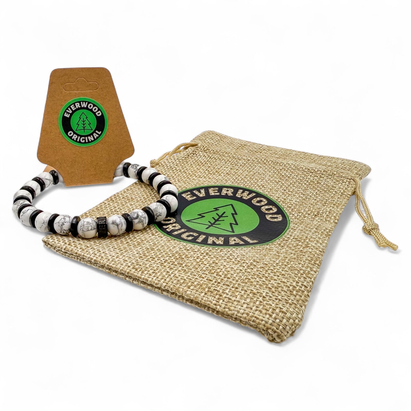 Included gift bag view of Pulse men’s beaded bracelet made with white howlite and blackwood beads